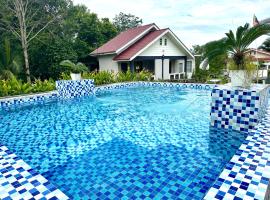 Kapal Terbang Guest House Langkawi, casa de huéspedes en Pantai Cenang