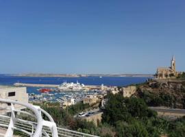 East Breeze Penthouse, alquiler vacacional en la playa en Mġarr