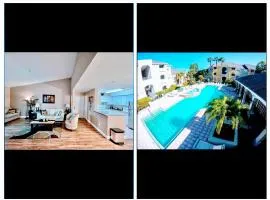 Dream Vacation Lovely Condo minutes from Beach King bed Heated pool Gym