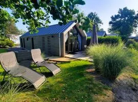 Das Holland Beachhouse, modern eingerichtet, in schöner Lage am Veluwemeer, inklusive Garten, Terrasse am Wasser, Parkplatz und WLAN