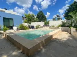 Departamento en “Casa Livia”, piscina y jardín.