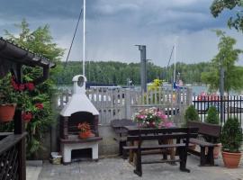 Domek przy promenadzie w Mikołajkach, hotel v destinaci Mikołajki