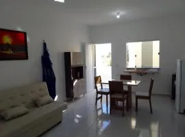 Sol Apartamento 4 - Quarto e sala com varanda e cozinha americana na praia do prea-CE