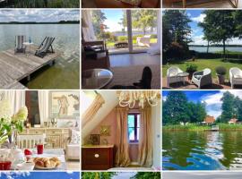 Mazurska Villa Deluxe w Pasymiu z prywatnym pomostem na jezioro Kalwa i łodzią na wyłączność Najwyższe Premium w Osada Zamkowa, rumah liburan di Pasym