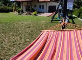 Villa Grunwald - rodzinny dom z dużym ogrodem, tarasem, grillem, domkiem dla dzieci i boiskiem