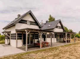 Domki Sasino - nowe, komfortowe, całoroczne domki nad morzem "Ranczo Sasino"