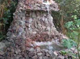 waterfall in the yard, B&B i Karakol