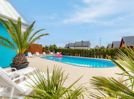 Domki Piaskowa11 Palm Resort & Wellness, viešbutis Leboje