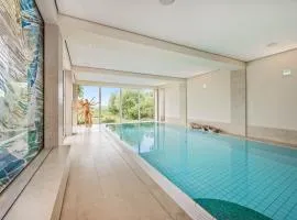 Wellness-Apartment mit Wasserblick, Pool, Sauna & Fitnessbereich