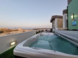 Millennium Penthouse with private Hot Tub Gozo, apartamento em Għajnsielem