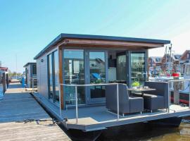 Tiny houseboat Parel I - airco, allotjament en vaixell a Uitgeest