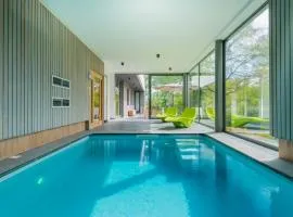 Modern villa with indoor swimming pool, in the middle of the Noiseaux nature