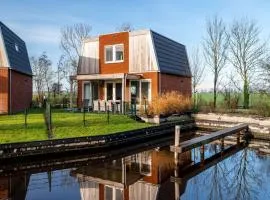 Spacious holiday home with outdoor spa, on a holiday park in Friesland