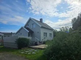 House near Reisa national park, Aurora and the Midnight sun
