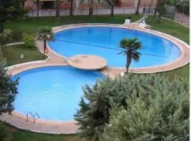 Acogedor apartamento en Daimús a 150 metros de la playa con parking privado y piscinas comunitarias