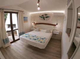 Oasi del Relax - Seaside Peaceful Panoramic Terrace in ITALY - new Sardinia apartment 50 mt beach&sea full comfort air conditioning-WiFi-Parking-Privacy, hotel in Torre Dei Corsari