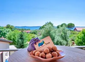 Teuta Apartments - a beach and a sea view