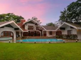 StayVista at Gulmohar Gardens with Gazebo, BBQ