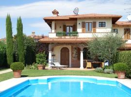 Spacious holiday home in Moniga del Garda with private pool, hotel in Moniga