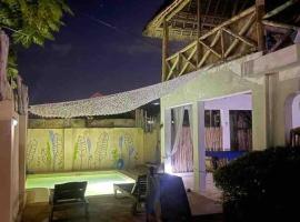 Villa64 - Afrikanische Villa mit Pool, къща тип котидж в Нунгви