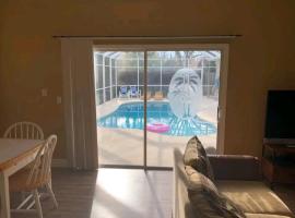 Guest house withl kitchen living room 65" tv solar heated pool, cheap hotel in Palm Coast