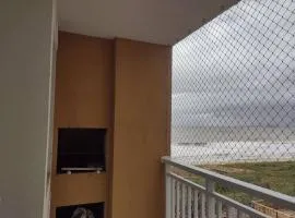 Condomínio pé na areia com piscina aquecida