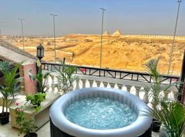Private jacuzzi Roof studio w/amazing Pyramids v, hotel v destinaci ‘Ezbet `Abd el-Ḥamîd