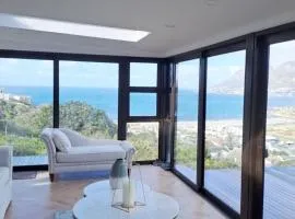 Modern mountainside home with ocean view - Minimal load shedding