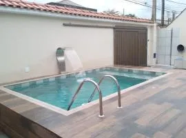 Casa espaçosa com Piscina e Churrasqueira 2 dorm