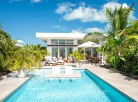 Romantic Getaway - Oceanside Large Modern Studio with Pool, 500ft from Long Bay Beach