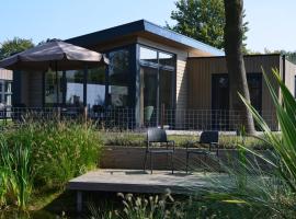 6 persoons bungalow met omheining van de tuin, хотел в Бидингхаузен