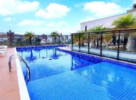 Apartamento Le Quartier - no centro, dois quartos, wi-fi, garagem, piscina, ar-condicionado, jacuzzi, sauna, etc, ξενοδοχείο σε Juiz de Fora