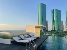 Cloud9 Waterfront Luxury Condo, semesterboende i Manama