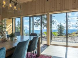 Unique new cabin by Hafjell & Skei with stunning view, Hotel in Tretten