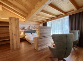 DOLOMITES B&B - Suites, Apartments and SPA, гірськолижний курорт у місті Тезеро