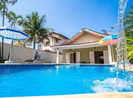 Casa com piscina em condomínio fechado em Bertioga, casa de temporada em Boraceia