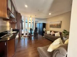 Appleone Ayala Condo with Balcony