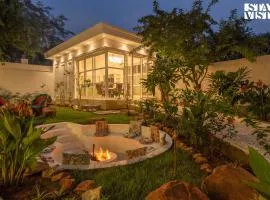StayVista's Indraj Manor - Roman-Inspired Villa with Posh Interiors, Mesmerizing Garden & Outdoor Fireplace