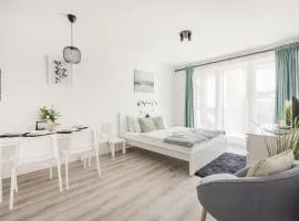 Modern Riverfront Apartment with Free Parking