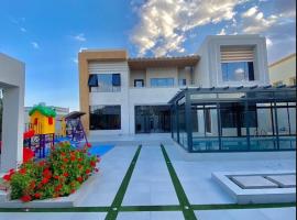 استراحة رافلز, hotel en Sayq