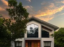 SaffronStays Arabella - 4BR bohemian pool villa with sunken lounge, foosball, PS4 & mango orchard views in Alibaug
