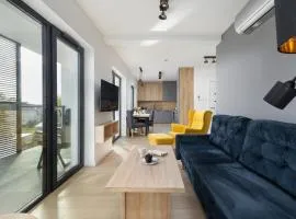 Air-Conditioned Seaside Apartment with Parking & Balcony by Noclegi Renters