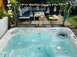 Évasion Tropicale - Studio Artiste Bali & Jacuzzi "Pour le studio avec baignoire SPA"，梅里尼亞克的飯店