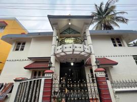 SAN HOME STAY, bed and breakfast en Mysore