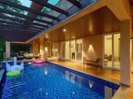 Inara by StayVista - Amidst lush greenery with Outdoor swimming pool & Indoor games