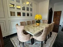 Rania Riverview Guesthouse #BestGuesthouseInTown #SpaciousLivingRoom #ModernClassicConcept #LuxuryDiningset #freeWifi #Netflix #FullyAircond #CozyPrayerSpace