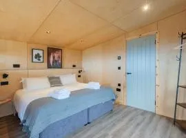 Rustic Cabins, sea views from rewilded farm with Highland Cows
