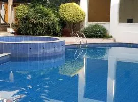 Amazistay offers Luxury room with private bathroom, balcony & 55 inch TV & shared Jacuzzi paid access, Book Lover, near Ramaiah College Hospital