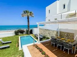 The Sea House beach front villa with pool