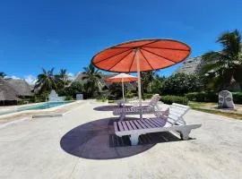 Karibuni, Villa 107, Beachfront Stay with Restaurant, Pool & Bar